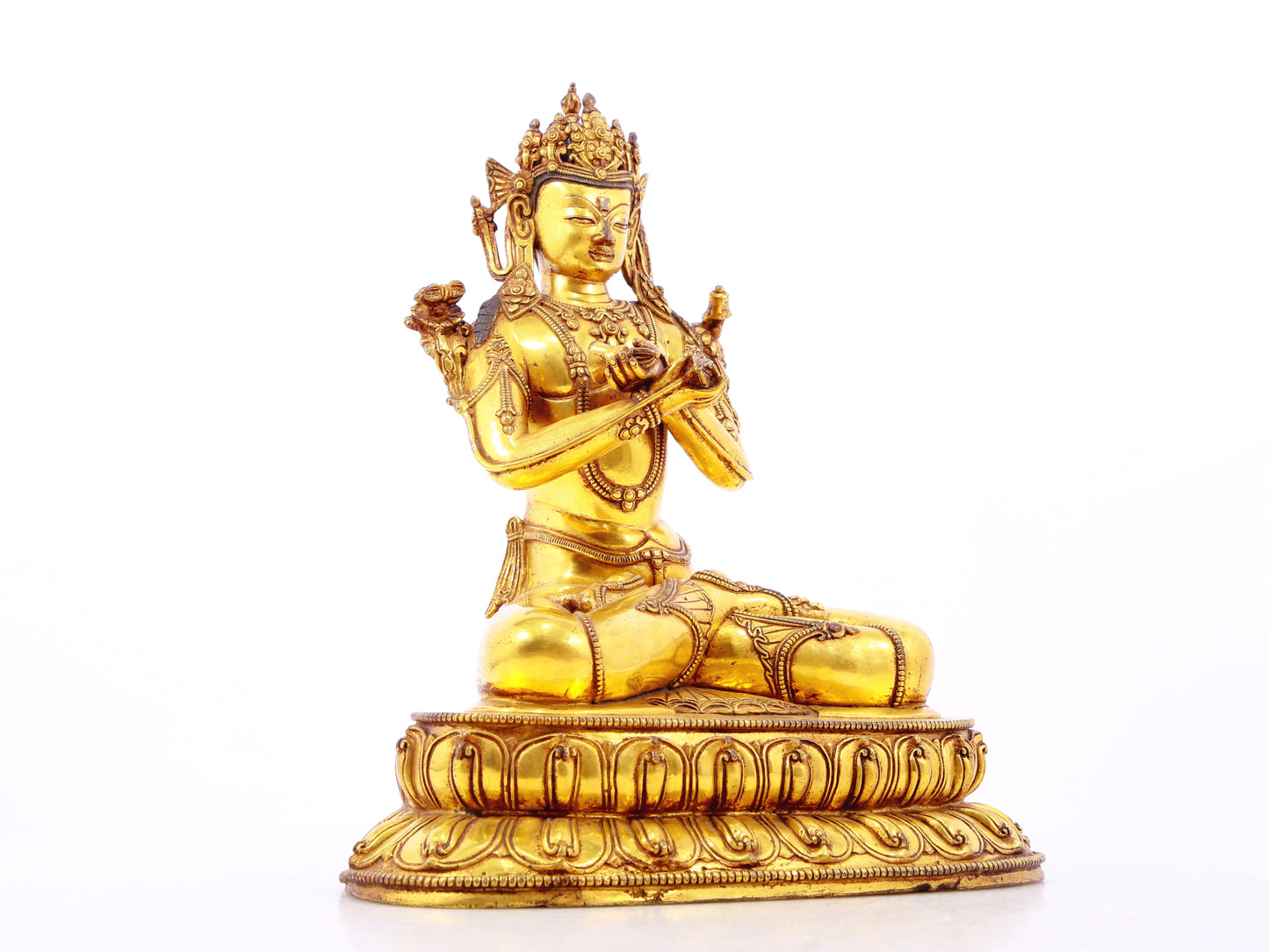 A serene gilt bronze statue of Vajrasattva