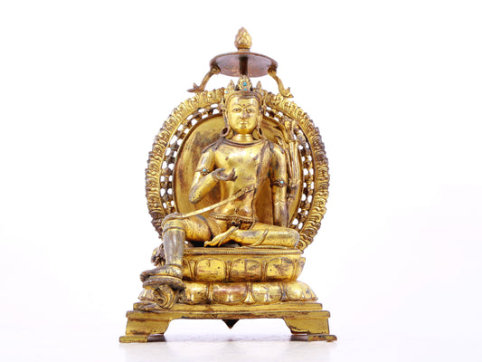 A solemn gilt bronze statue of green Tara