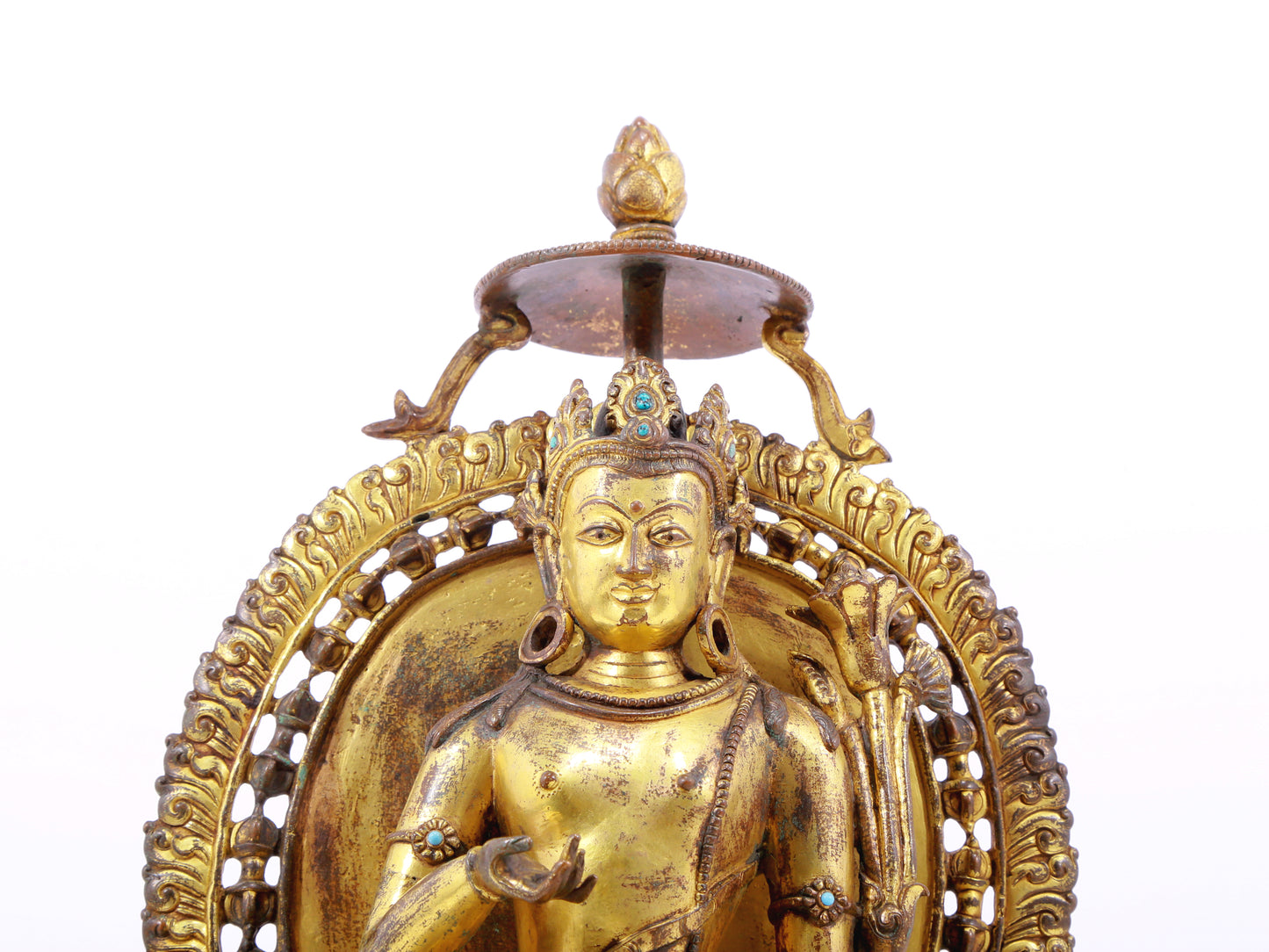 A solemn gilt bronze statue of green Tara