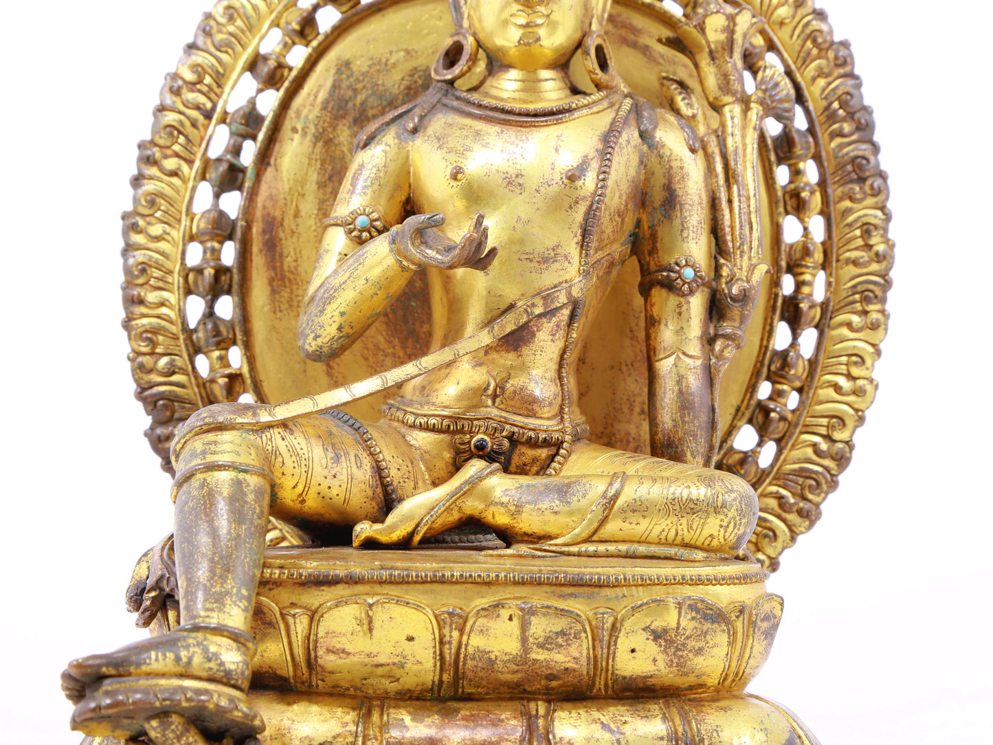 A solemn gilt bronze statue of green Tara