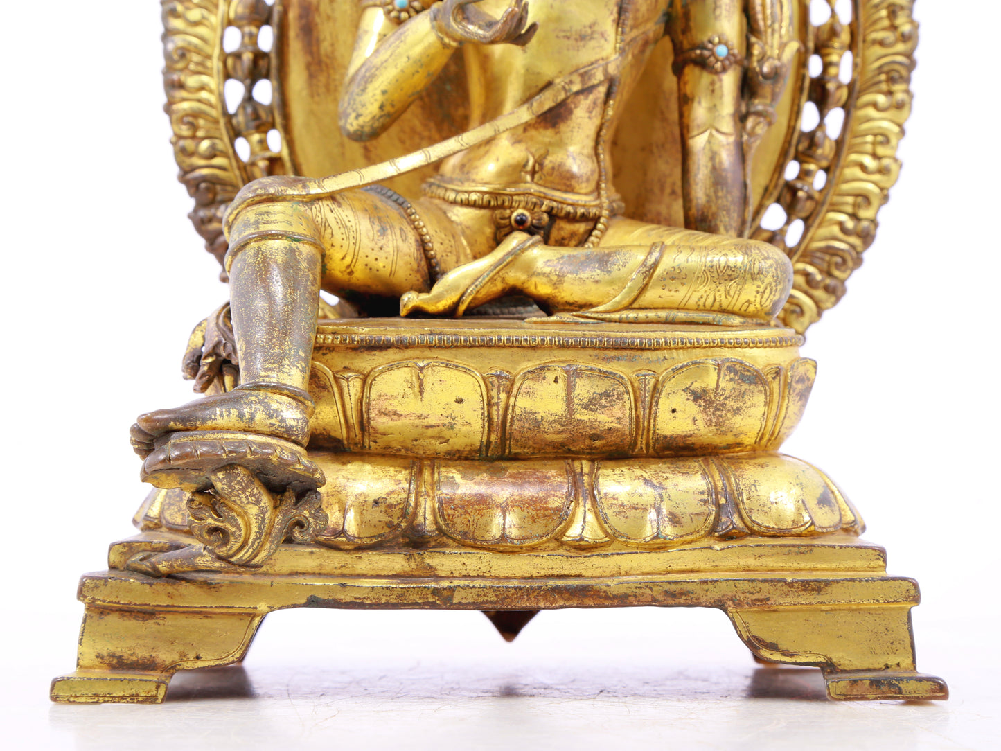 A solemn gilt bronze statue of green Tara