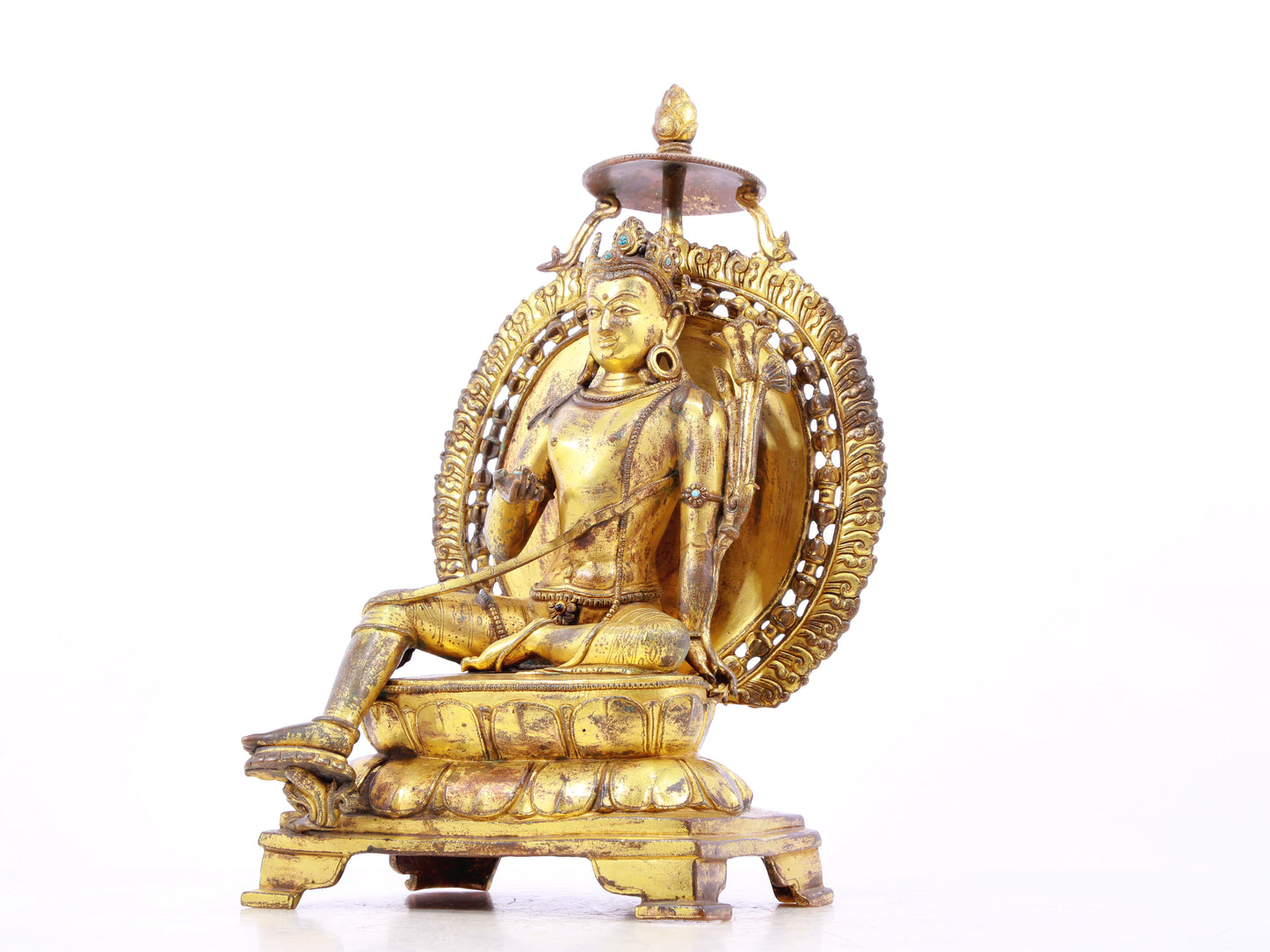 A solemn gilt bronze statue of green Tara