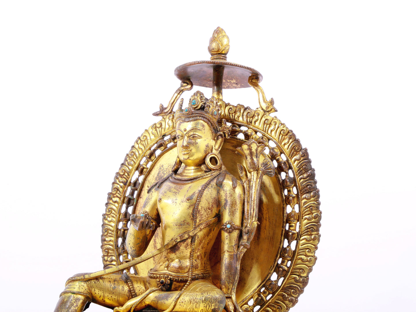 A solemn gilt bronze statue of green Tara