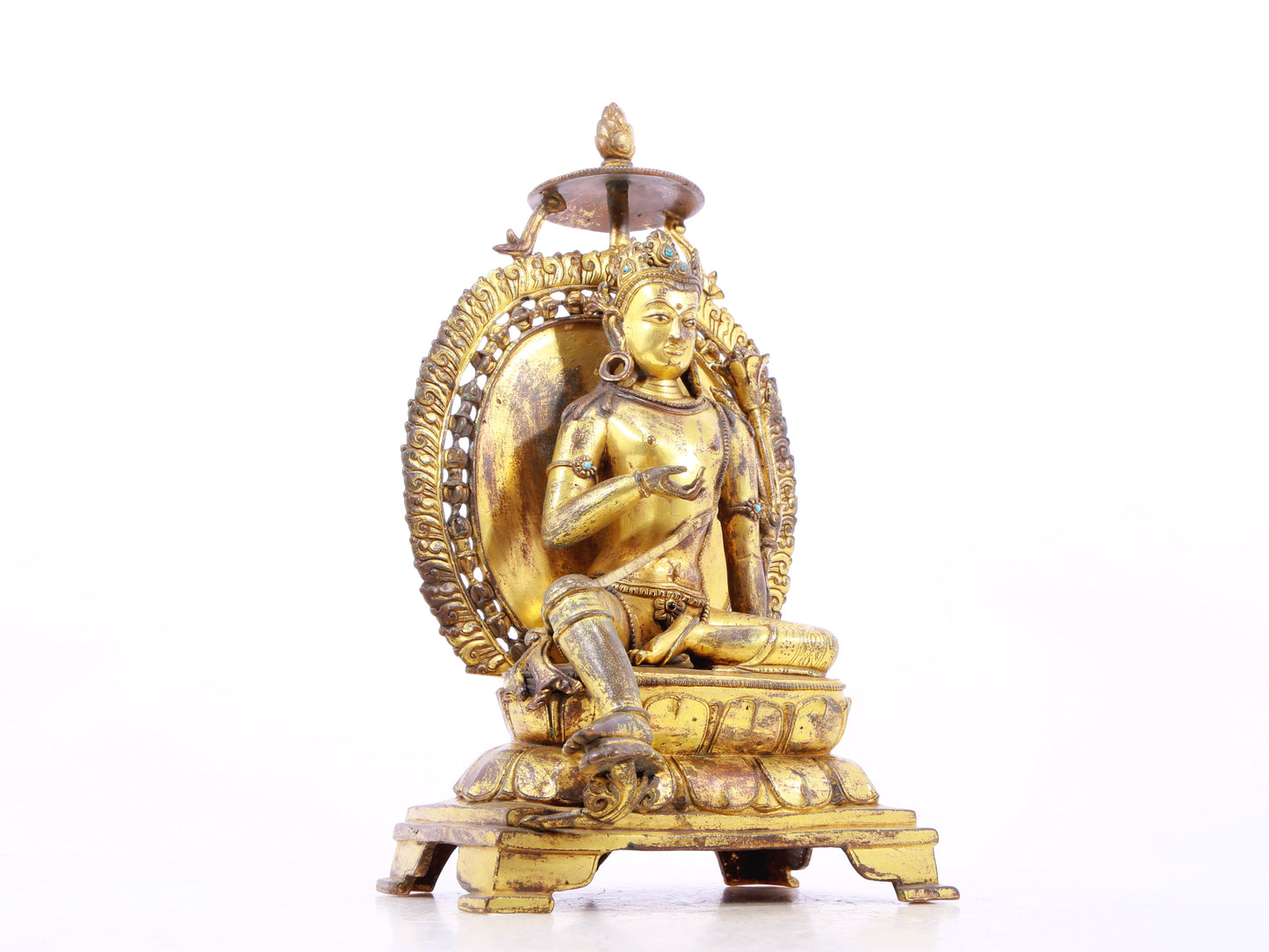 A solemn gilt bronze statue of green Tara