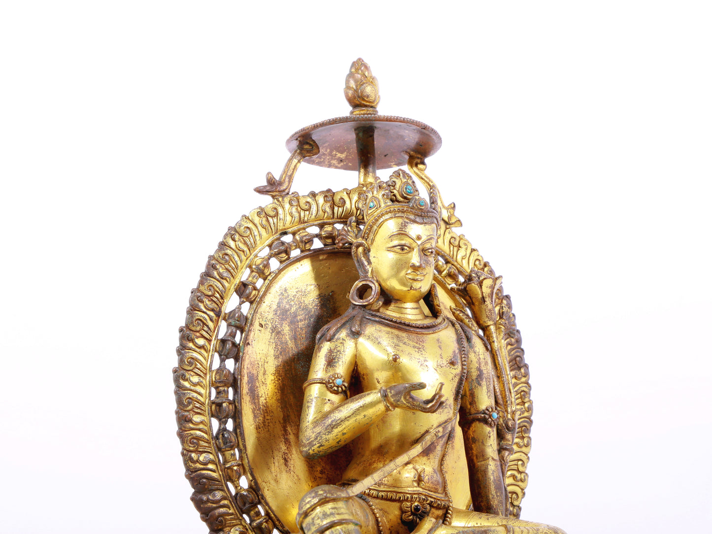 A solemn gilt bronze statue of green Tara