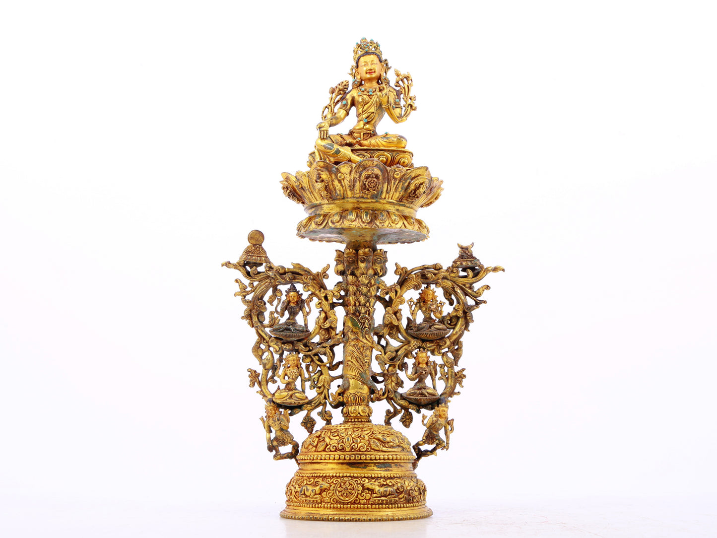 A serene gilt bronze statue of Tara inlaid with turquoise green