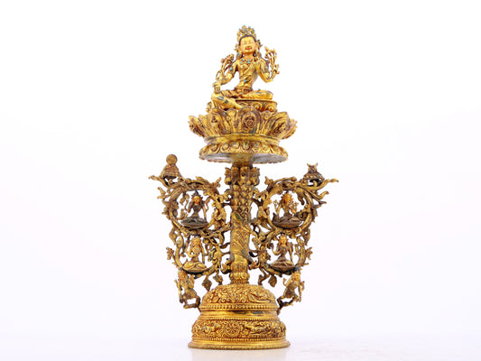 A serene gilt bronze statue of Tara inlaid with turquoise green