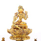 A serene gilt bronze statue of Tara inlaid with turquoise green