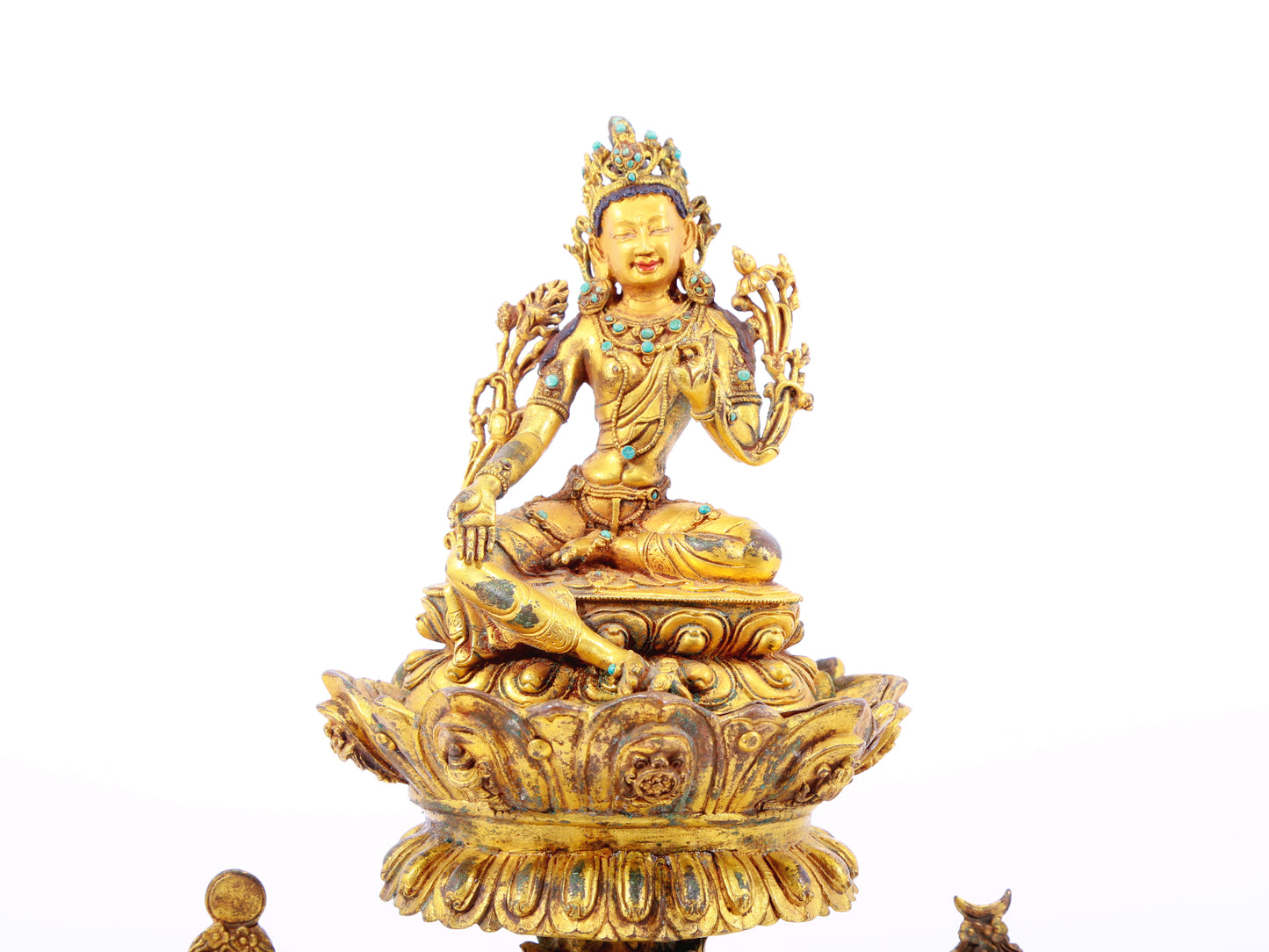 A serene gilt bronze statue of Tara inlaid with turquoise green