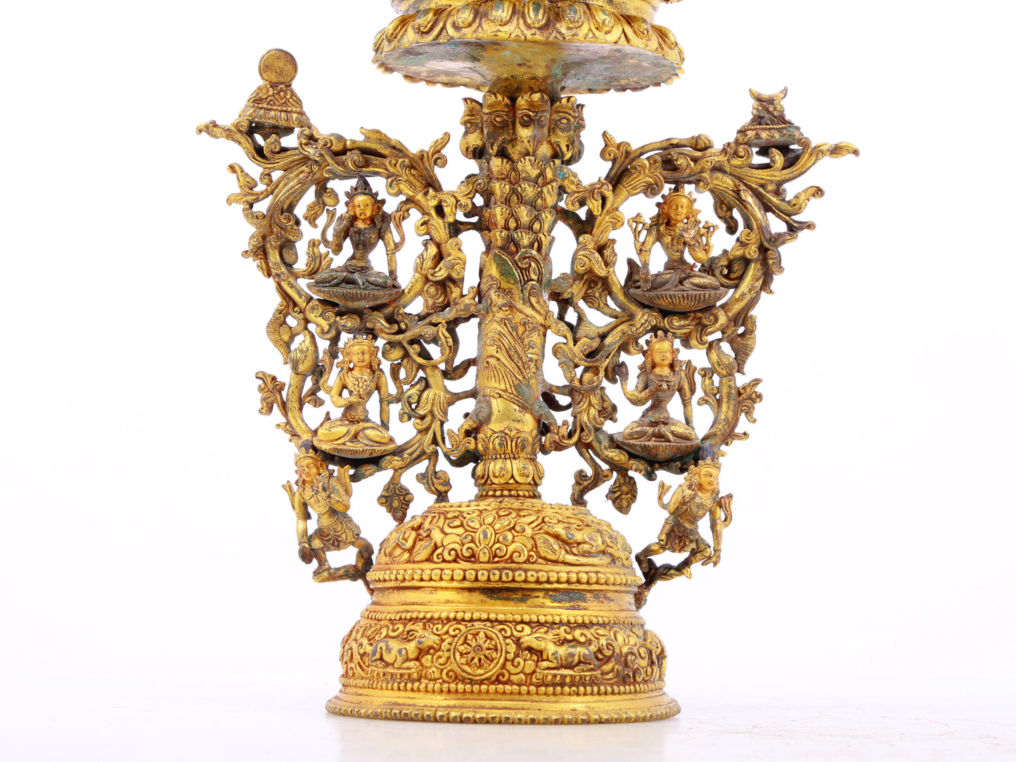 A serene gilt bronze statue of Tara inlaid with turquoise green