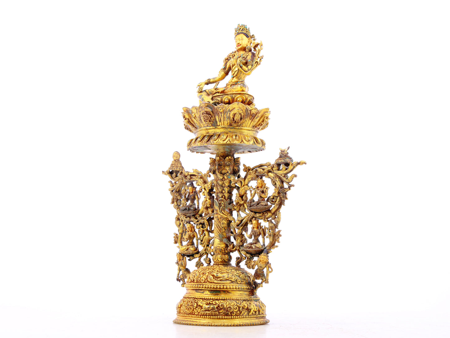 A serene gilt bronze statue of Tara inlaid with turquoise green