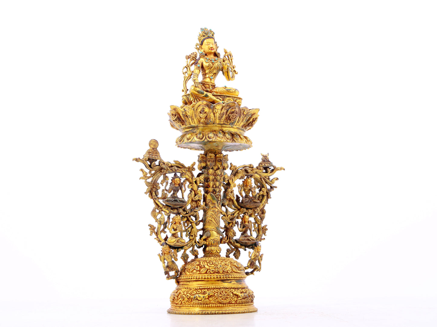 A serene gilt bronze statue of Tara inlaid with turquoise green