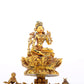 A serene gilt bronze statue of Tara inlaid with turquoise green