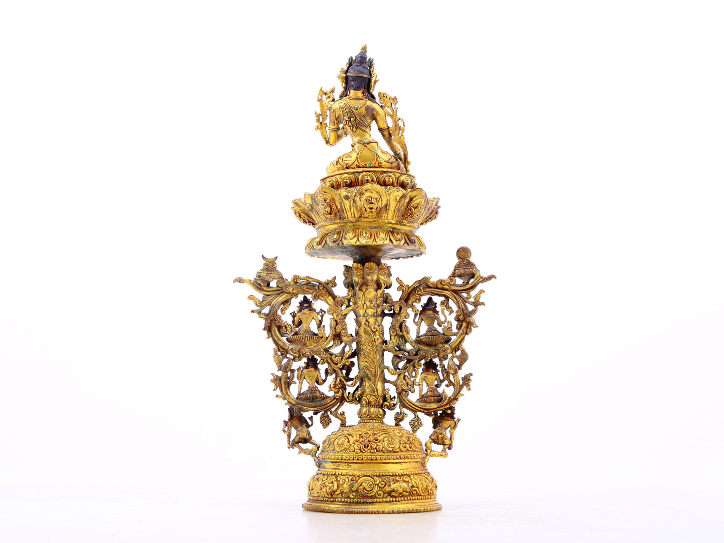 A serene gilt bronze statue of Tara inlaid with turquoise green