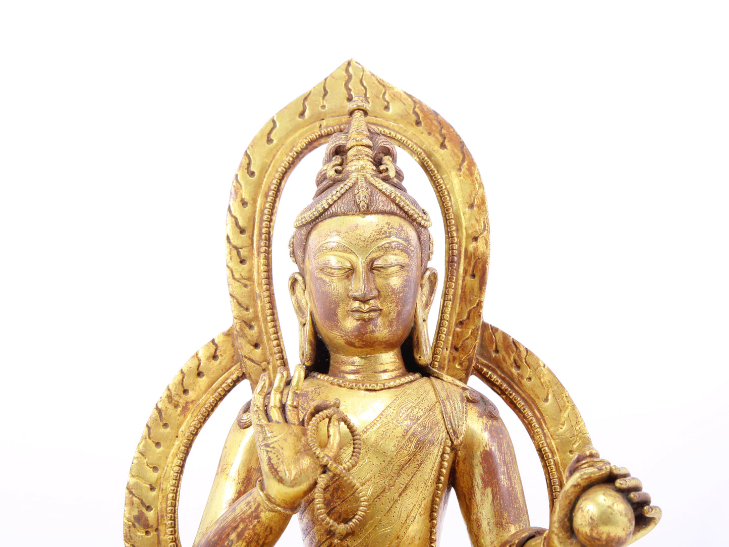 A solemn gilt bronze statue of Tara