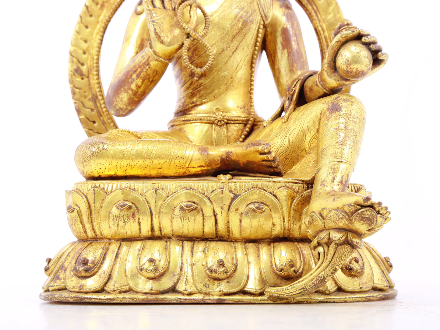 A solemn gilt bronze statue of Tara