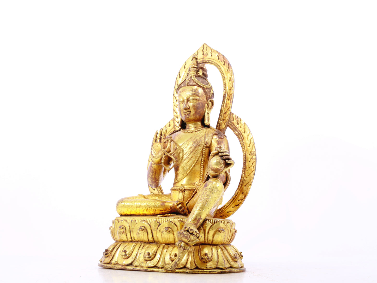 A solemn gilt bronze statue of Tara