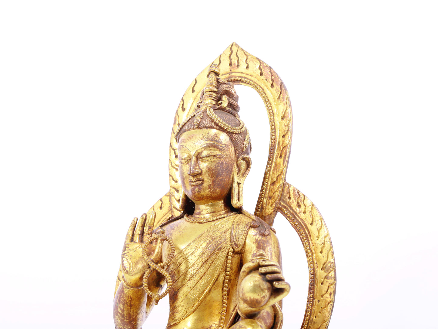 A solemn gilt bronze statue of Tara