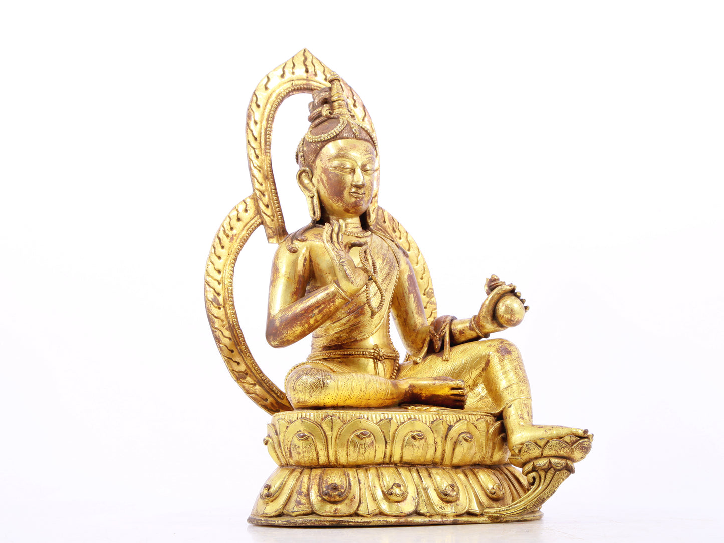 A solemn gilt bronze statue of Tara