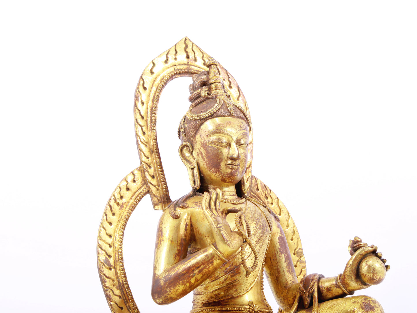 A solemn gilt bronze statue of Tara