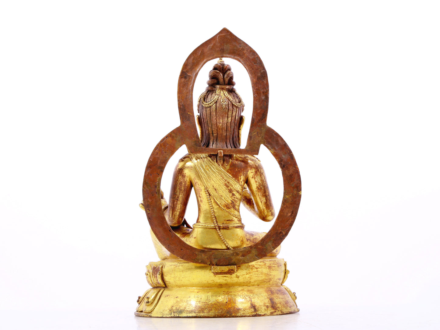 A solemn gilt bronze statue of Tara