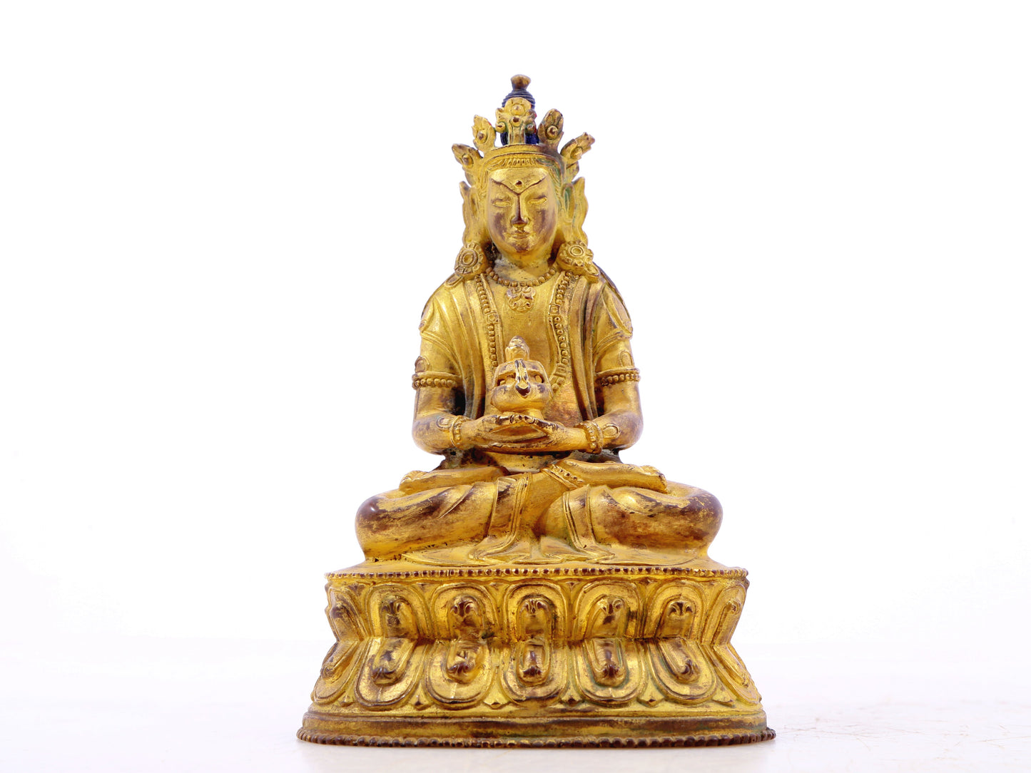 A serene gilt bronze statue of Amitayus Buddha