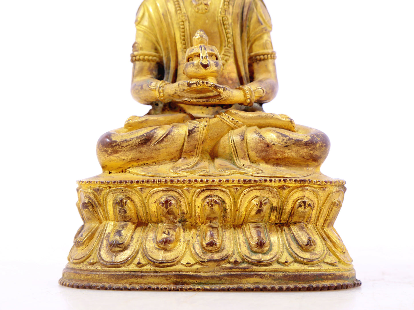 A serene gilt bronze statue of Amitayus Buddha