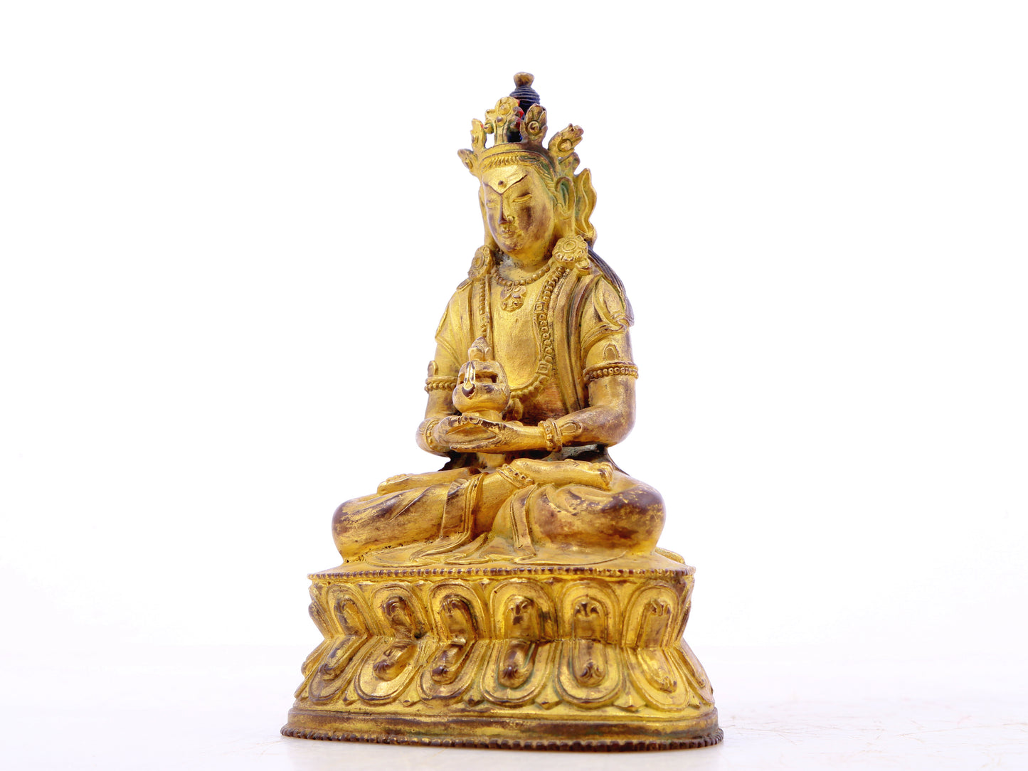 A serene gilt bronze statue of Amitayus Buddha