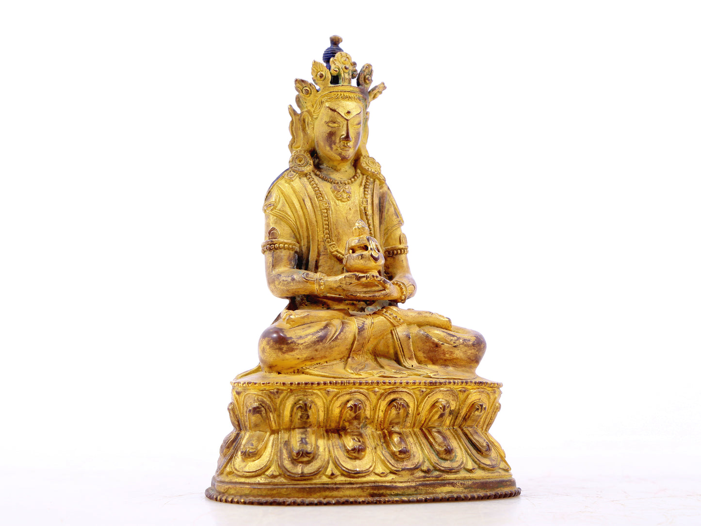 A serene gilt bronze statue of Amitayus Buddha