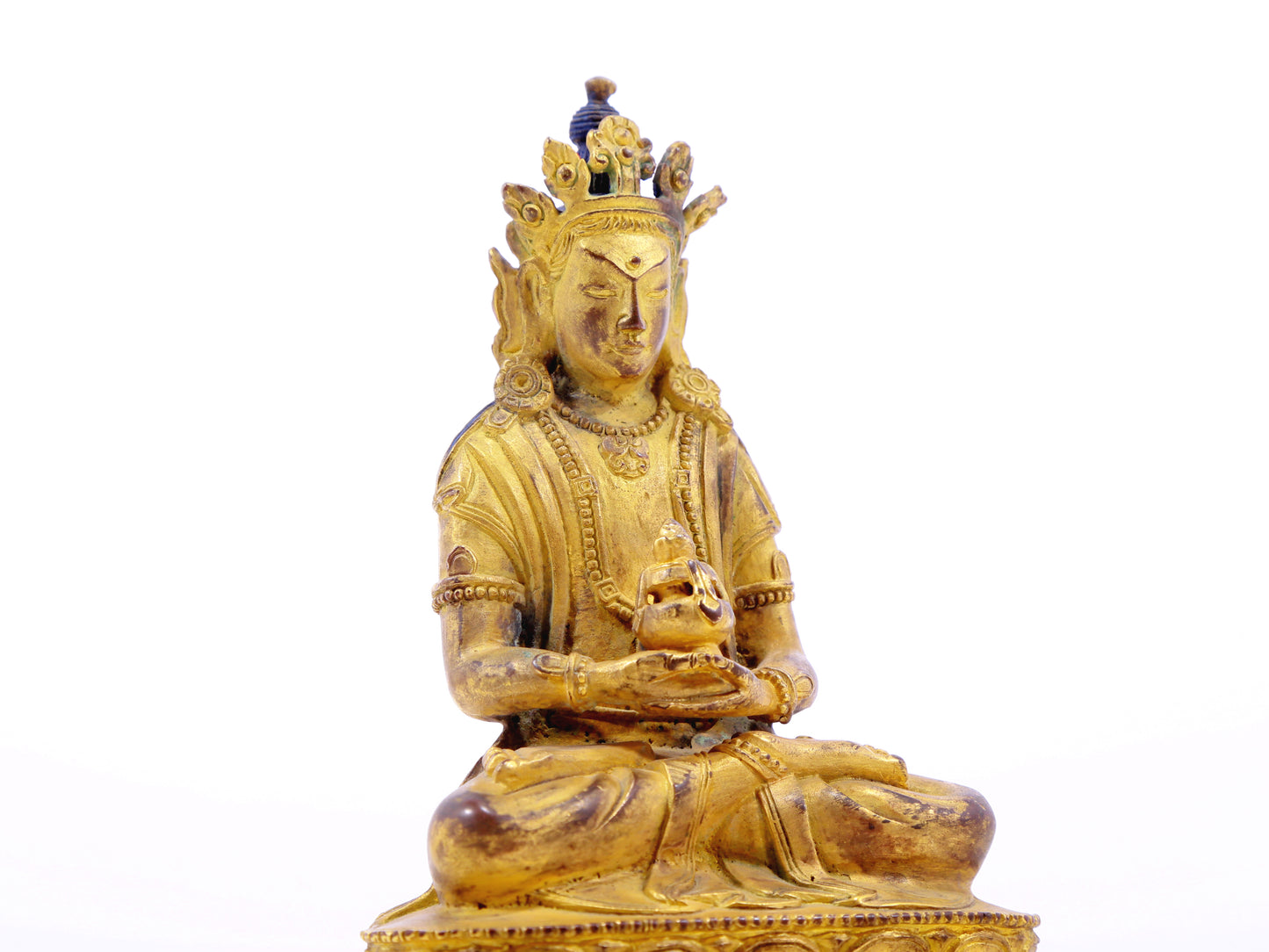 A serene gilt bronze statue of Amitayus Buddha