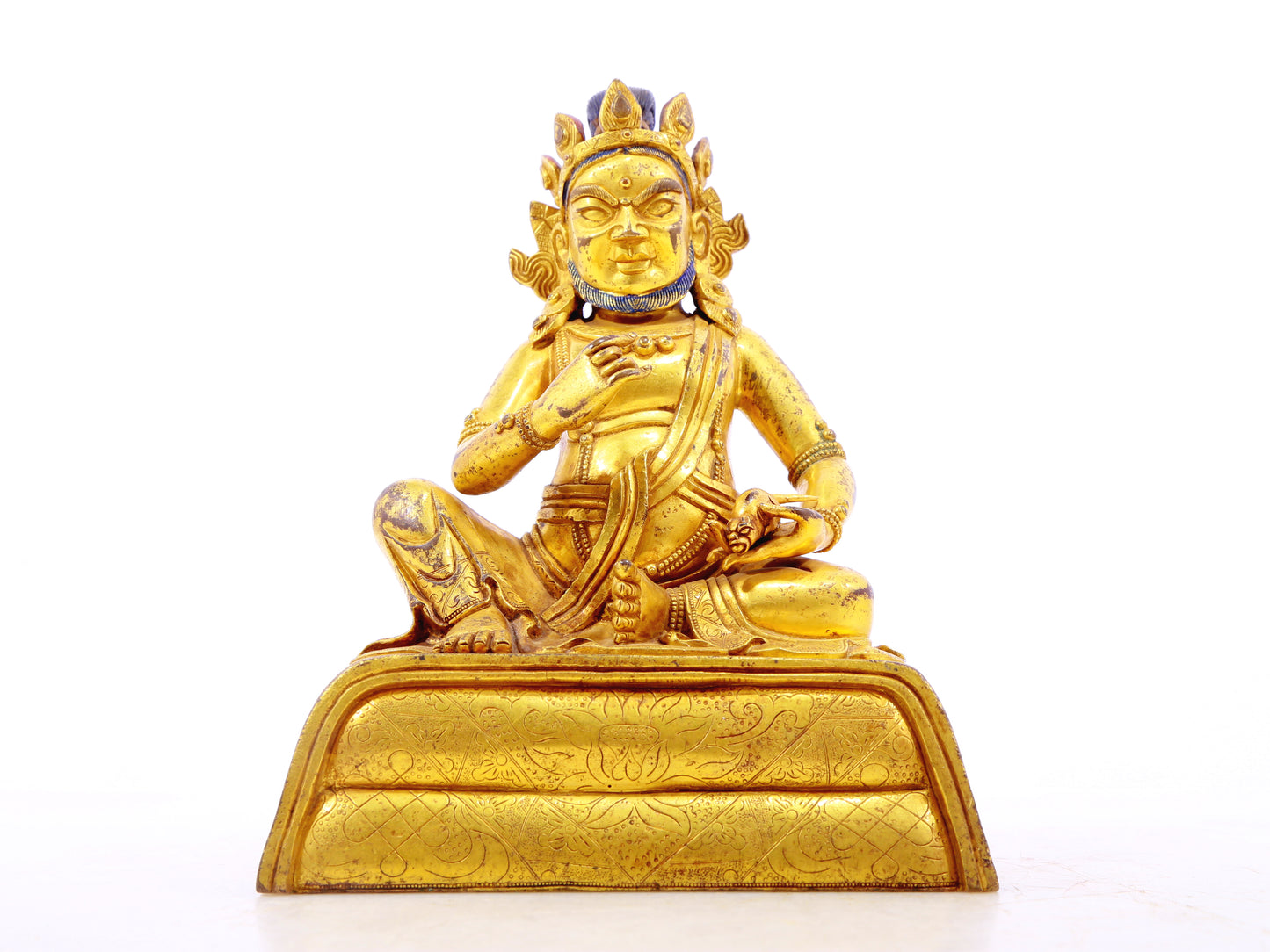 A serene gilt bronze statue of the God of Wealth