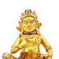 A serene gilt bronze statue of the God of Wealth