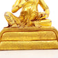 A serene gilt bronze statue of the God of Wealth