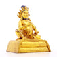 A serene gilt bronze statue of the God of Wealth