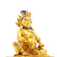 A serene gilt bronze statue of the God of Wealth