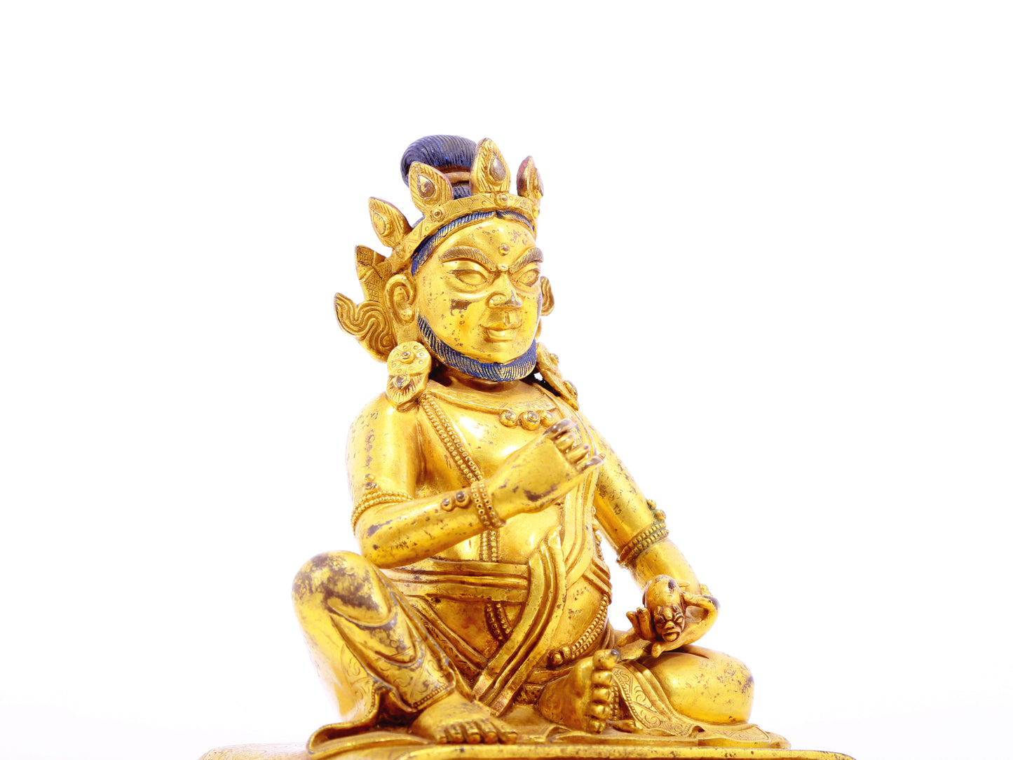 A serene gilt bronze statue of the God of Wealth