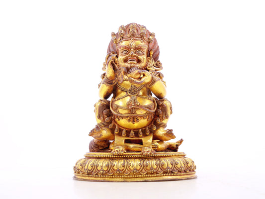 A serene gilt bronze statue of the God of Wealth