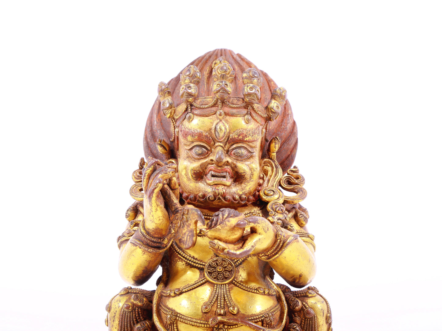 A serene gilt bronze statue of the God of Wealth