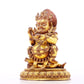 A serene gilt bronze statue of the God of Wealth