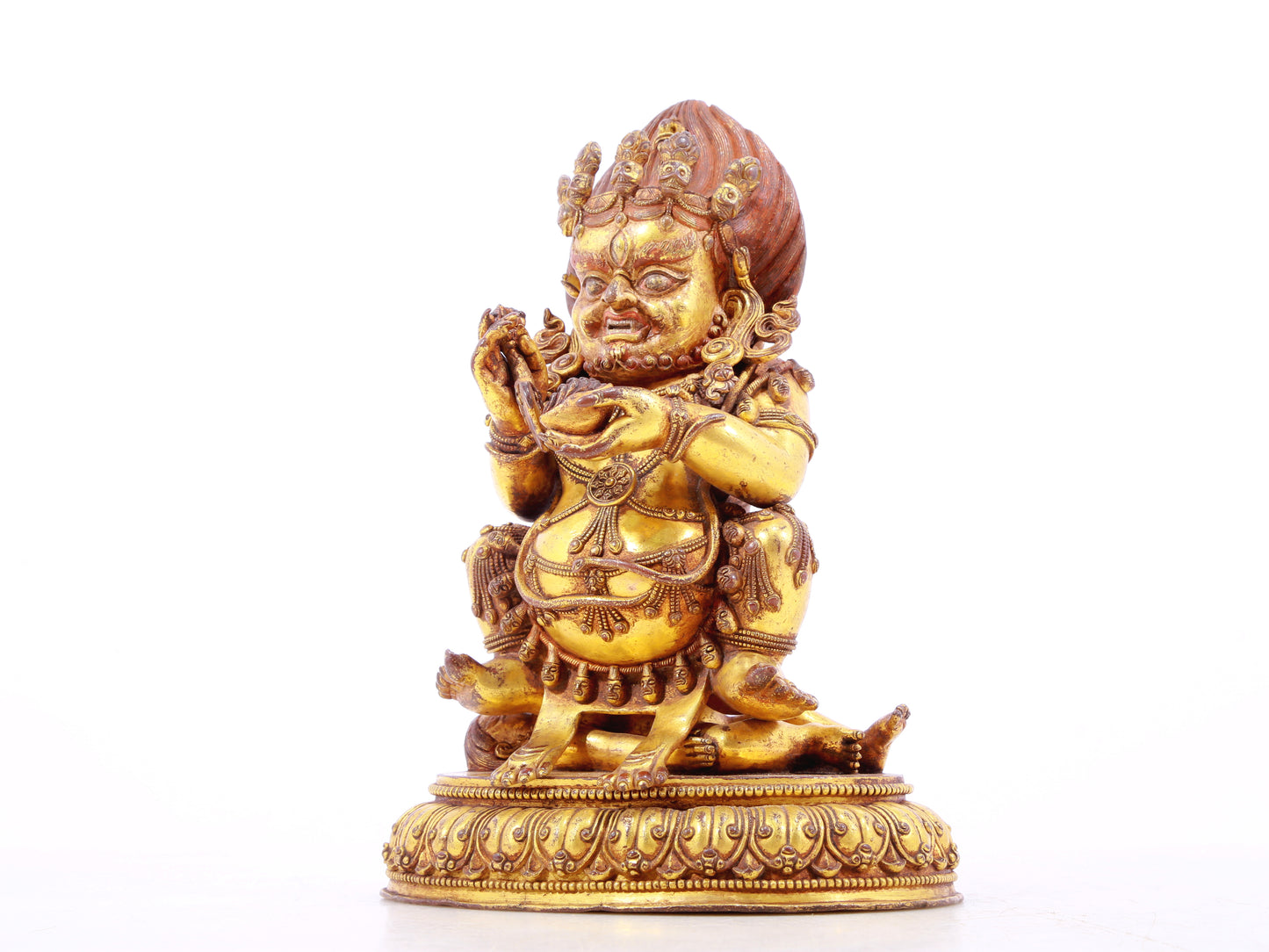 A serene gilt bronze statue of the God of Wealth