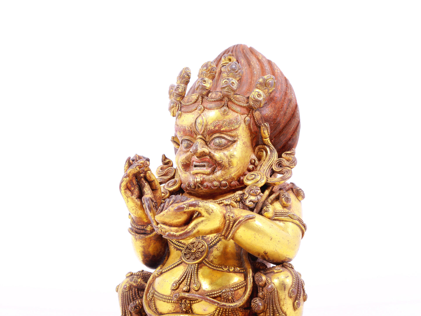 A serene gilt bronze statue of the God of Wealth