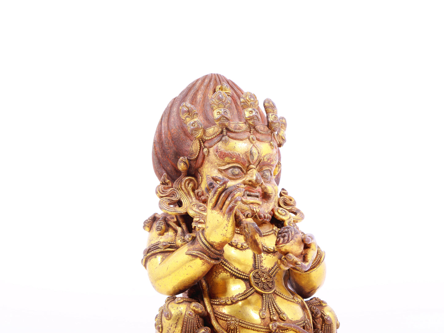 A serene gilt bronze statue of the God of Wealth