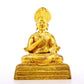 A serene gilt bronze statue of the guru