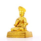 A serene gilt bronze statue of the guru