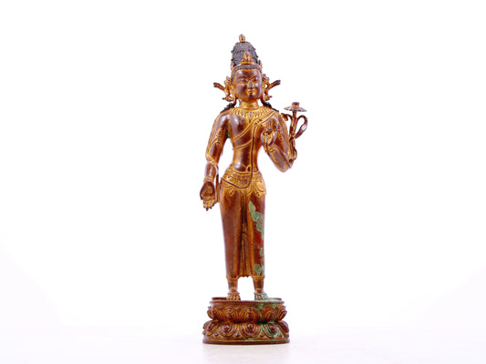 A serene gilt bronze statue of Tara