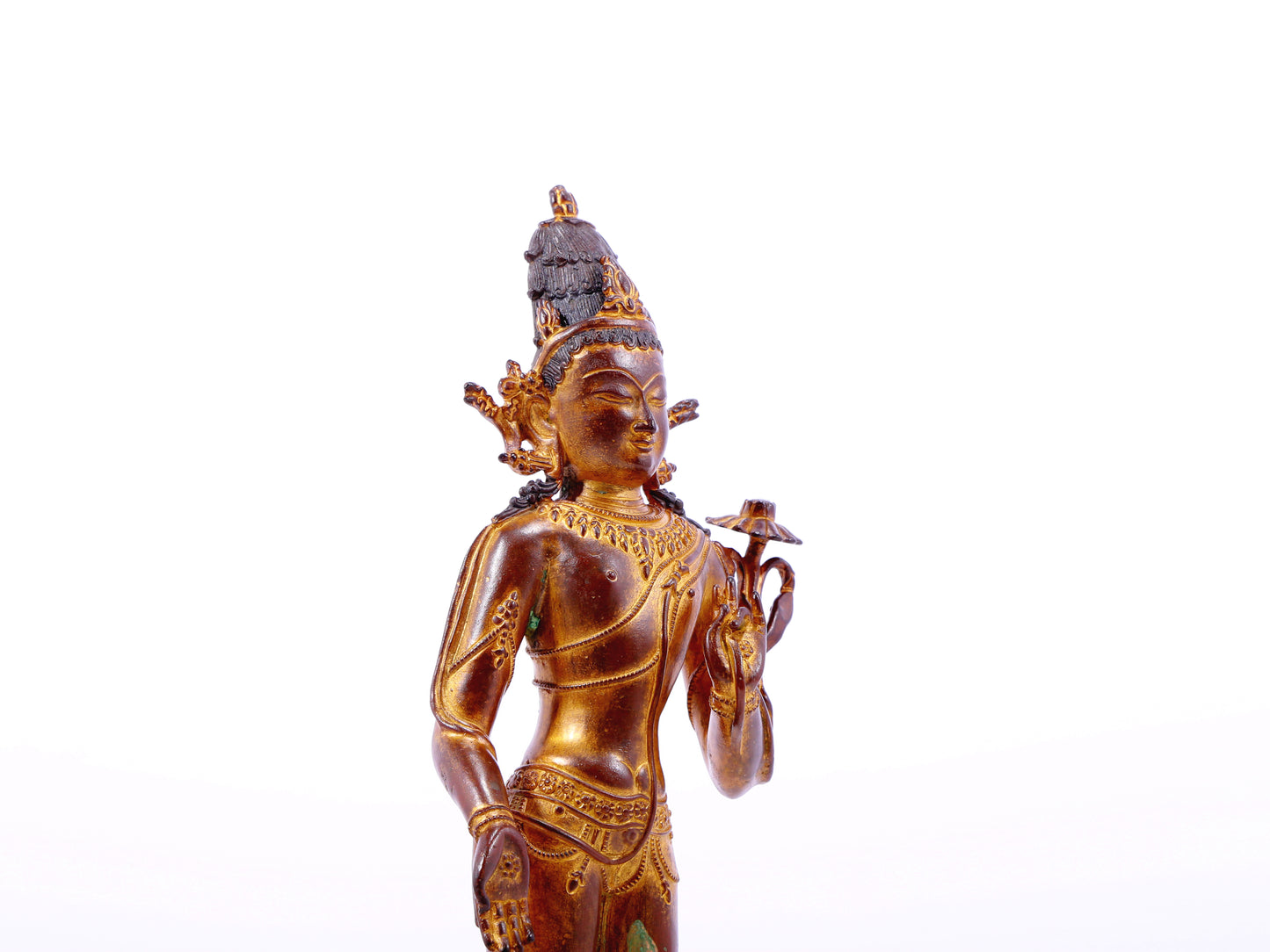 A serene gilt bronze statue of Tara