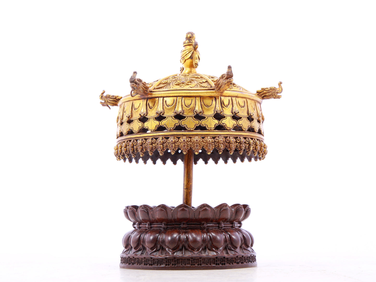 A serene gilt bronze lotus pattern