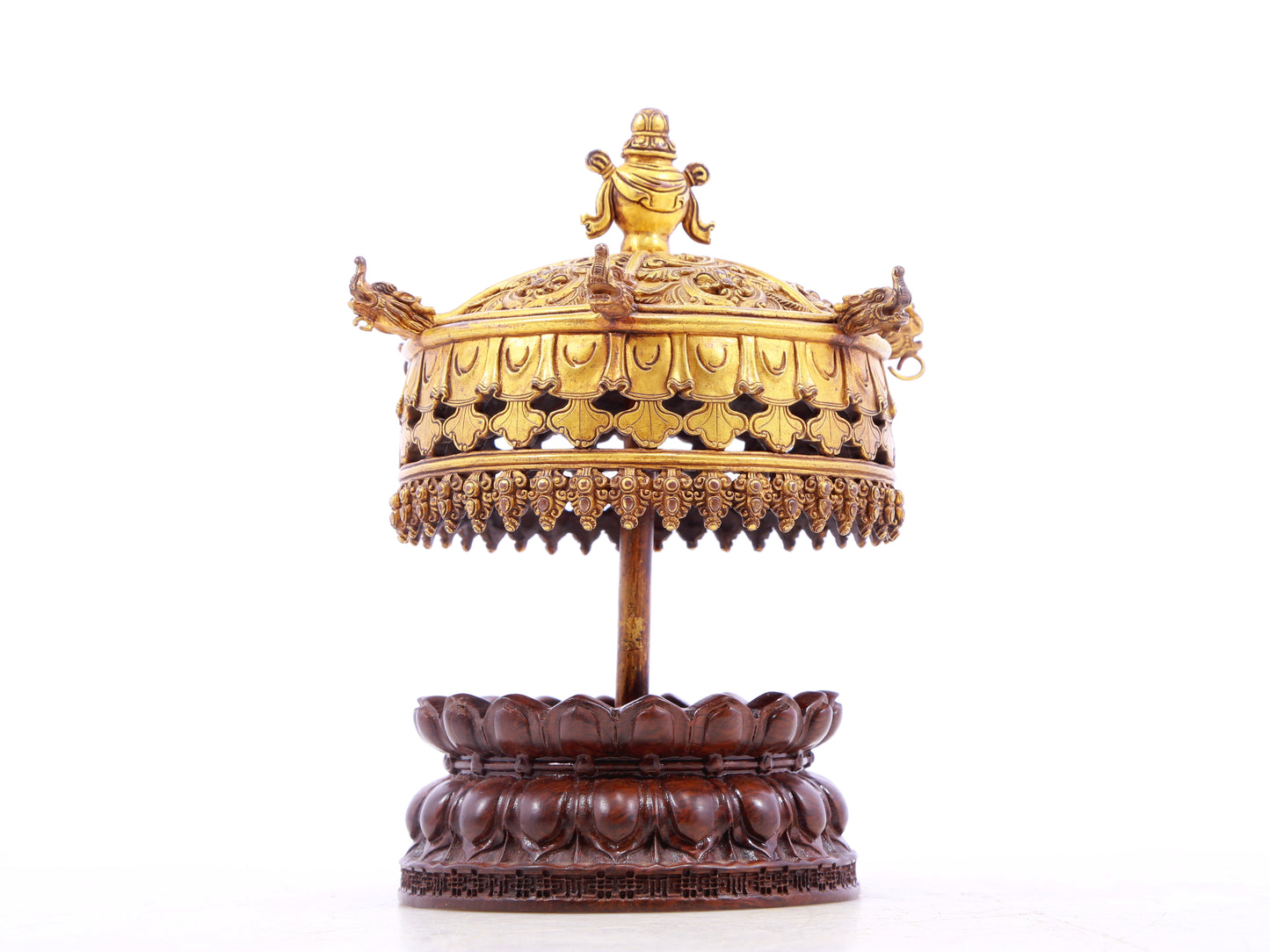 A serene gilt bronze lotus pattern