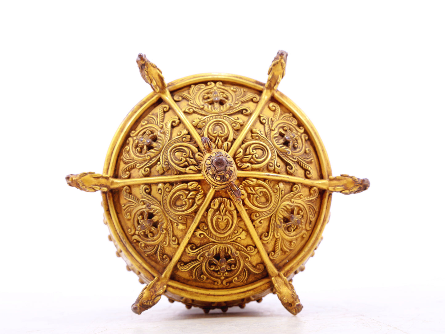 A serene gilt bronze lotus pattern