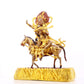 A serene gilt bronze equestrian statue of the God of Wealth